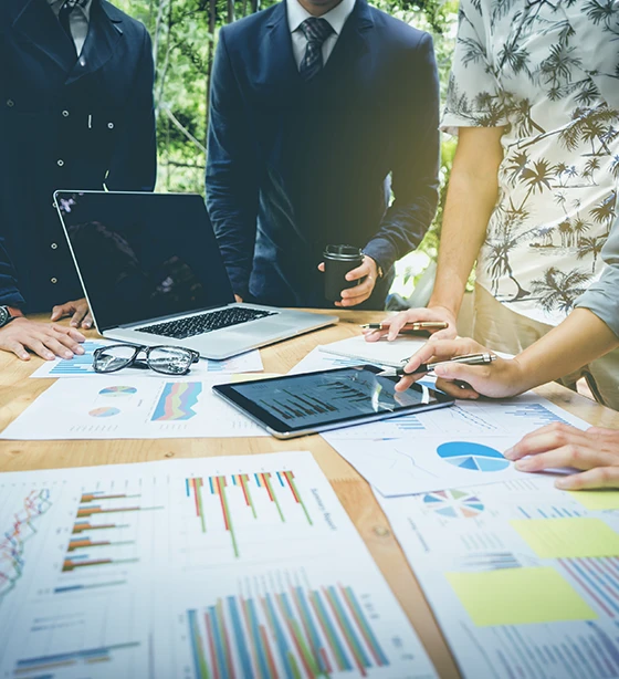 Digital Ethnography professionals collaborating to evaluate market research data and customer behaviour trends