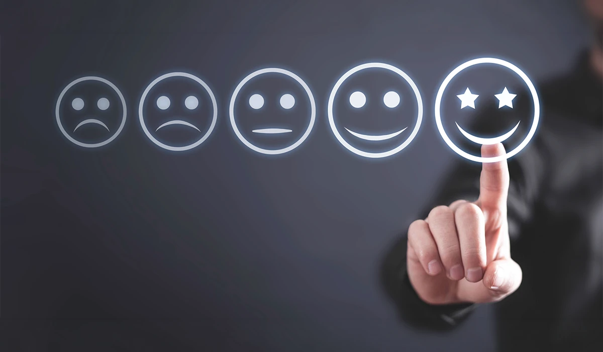 A businessman selecting a high-rating glowing smiley face icon, representing excellent customer satisfaction metrics from field survey services in the UAE.