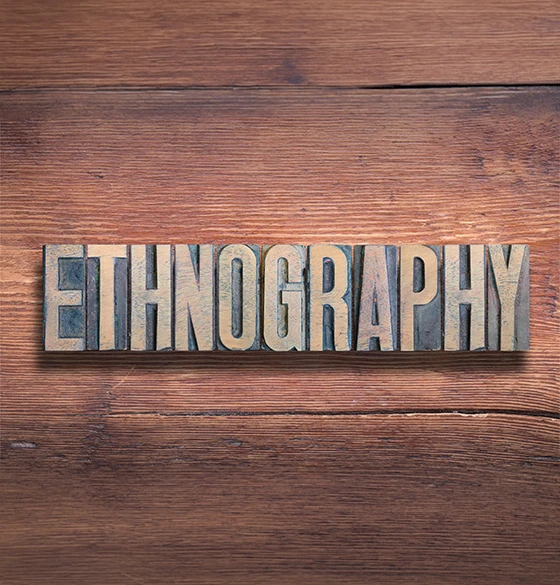 The word ETHNOGRAPHY spelled out in vintage wooden letterpress block letters on a textured wooden background, highlighting our ethnography practice.